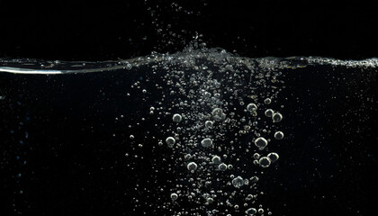 Bubbles emerging from below, underwater, gushing, carbonic acid, liquid, water, surging, black background, close-up