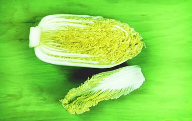 Fresh chinese cabbage  on wooden table, top view