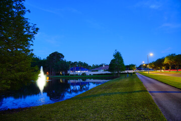 A Florida fountain and pond at night