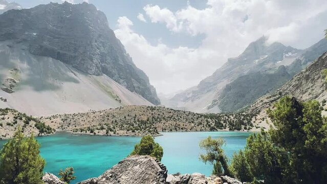 The Alaudin (Chapdara) lakes, lying at an altitude of 2800 m, are considered one of the most beautiful lakes of the Fan Mountains. Turquoise mountain lake. Pamiro-Alai. Tajikistan, Pamir 4K