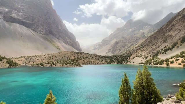 The Alaudin (Chapdara) lakes, lying at an altitude of 2800 m, are considered one of the most beautiful lakes of the Fan Mountains. Turquoise mountain lake. Pamiro-Alai. Tajikistan, Pamir 4K
