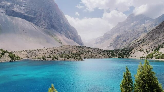The Alaudin (Chapdara) lakes, lying at an altitude of 2800 m, are considered one of the most beautiful lakes of the Fan Mountains. Turquoise mountain lake. Pamiro-Alai. Tajikistan, Pamir 4K