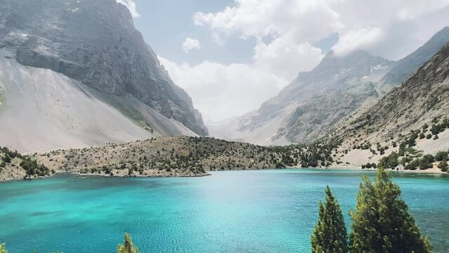 The Alaudin (Chapdara) lakes, lying at an altitude of 2800 m, are considered one of the most beautiful lakes of the Fan Mountains. Turquoise mountain lake. Pamiro-Alai. Tajikistan, Pamir 4K