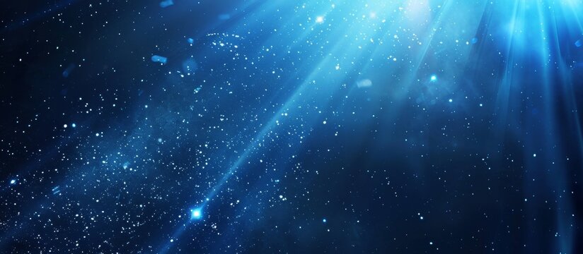 Bright blue light shines through the dark expanse of the night sky casting a mesmerizing glow