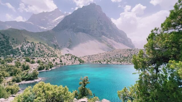 The Alaudin (Chapdara) lakes, lying at an altitude of 2800 m, are considered one of the most beautiful lakes of the Fan Mountains. Turquoise mountain lake. Pamiro-Alai. Tajikistan, Pamir 4K