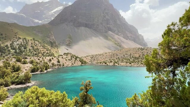 The Alaudin (Chapdara) lakes, lying at an altitude of 2800 m, are considered one of the most beautiful lakes of the Fan Mountains. Turquoise mountain lake. Pamiro-Alai. Tajikistan, Pamir 4K