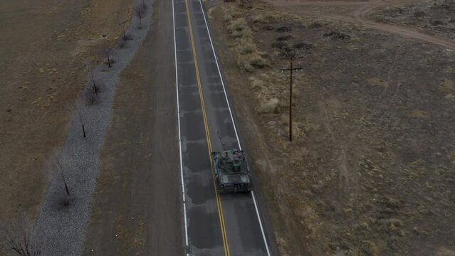 Epic drone shot following old tank on freeway 