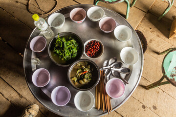 Lunch in a local house in Samarkisay village in Phongsali province, Laos