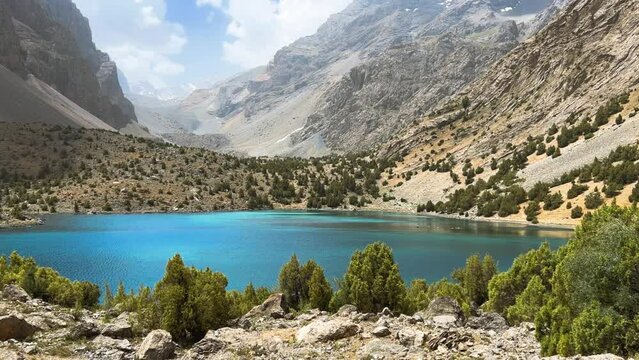 The Alaudin (Chapdara) lakes, lying at an altitude of 2800 m, are considered one of the most beautiful lakes of the Fan Mountains. Turquoise mountain lake. Pamiro-Alai. Tajikistan, Pamir 4K