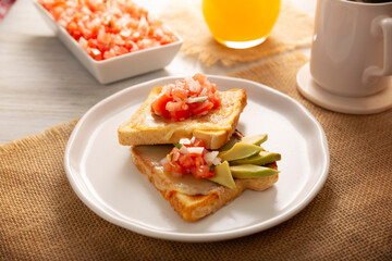 Breakfast toast with refried beans, avocado, melted cheese and mexican pico de gallo sauce. Easy and healthy homemade recipe that can be made in the oven, frying pan or air fryer. - 787758079