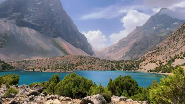The Alaudin (Chapdara) lakes, lying at an altitude of 2800 m, are considered one of the most beautiful lakes of the Fan Mountains. Turquoise mountain lake. Pamiro-Alai. Tajikistan, Pamir 4K