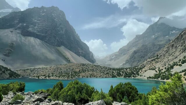 The Alaudin (Chapdara) lakes, lying at an altitude of 2800 m, are considered one of the most beautiful lakes of the Fan Mountains. Turquoise mountain lake. Pamiro-Alai. Tajikistan, Pamir 4K