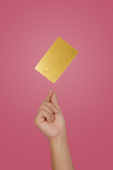 male hand holding floating gold Bank credit Card mockup template on isolated background