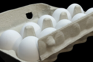 A Dozen of Freshness: White Eggs Nestled in a Carton