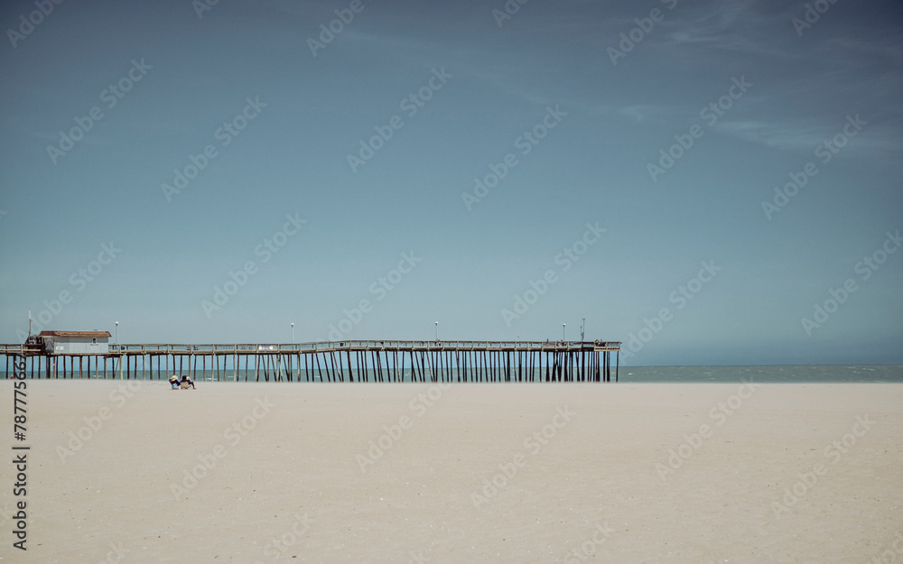 Sticker sandy beach and calm sea with clear blue sky ocean city maryland