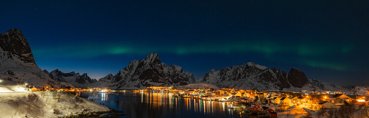 Winter landscape in Lofoten islands, Norway, with northern lights.