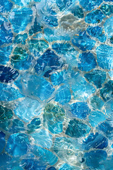 Close up of a swimming pool with azure liquid and blue rocks