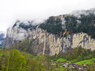 Landscape of Lauterbrunnen village in an Alps mountains valley, Switzerland. 