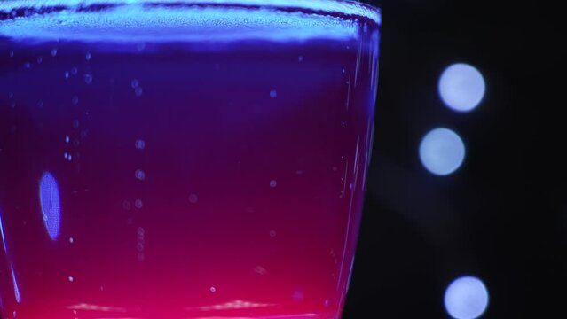 Blue Colorful Soda with a Black Background bokeh