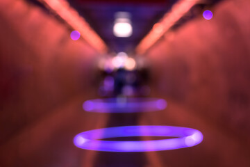 Abstract blurred walkway with bokeh of colorful LED light tunnel - 787814421