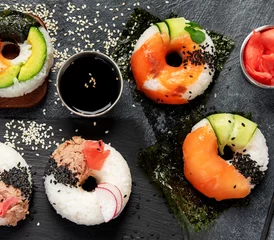  Sushi donuts on a dark background. Hybrid trend food. © bit24