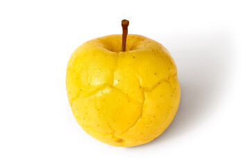Yellow soaked apple on white background. Soaked apple isolated. With a shadow.