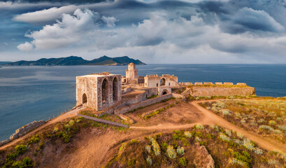 Dramatic summer view from flying drone of old Methoni Castle. Aerial seascape of Ionian sea....