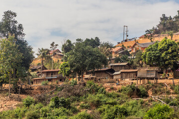 Fototapeta na wymiar Village above waters of Nam Ou 3 reservoir, Laos