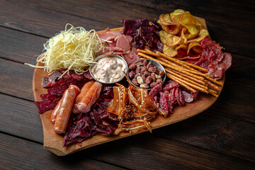 Plateau for a large company with different types of sausages and meat: sujuk, smoked sausages,...