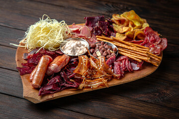 Plateau for a large company with different types of sausages and meat: sujuk, smoked sausages,...