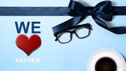 Black ribbon and eyeglasses with a red heart and We Love Father's text