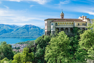 Locarno city and lake Maggiore with Madonna del Sasso Sanctuary (15th century) in the foreground, at the Sacred Mount Madonna del Sasso in Orselina, Switzerland 
