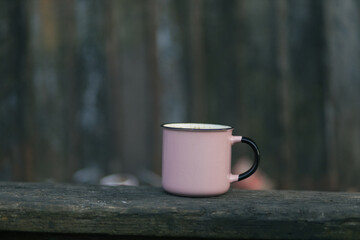 cup of coffee on a wooden background