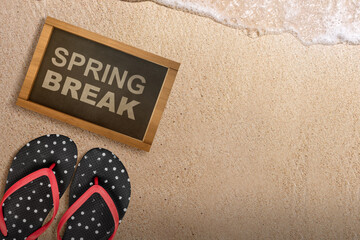 Slipper and small chalkboard with Spring Break text