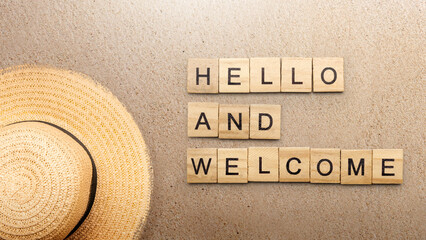 A row of wooden cubes with hello and welcome text - 787869292
