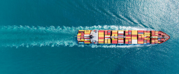 Express Cargo Container Ship with contrail in the ocean ship carrying container and running for...