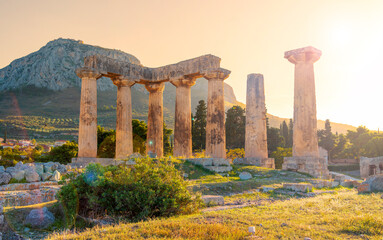 Ruins of temple of Apollo at sunset, Ancient Corinth in Greece
