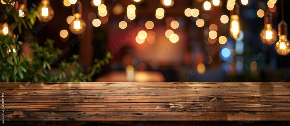 Sticker Wooden table in front of a blurred background featuring restaurant lights.