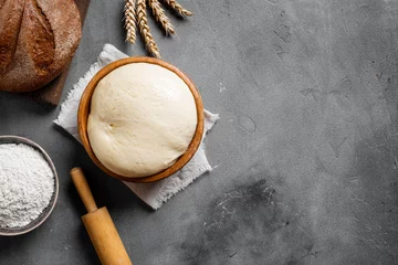 Tapeten Baking and kneading background with ball of dough © mizina