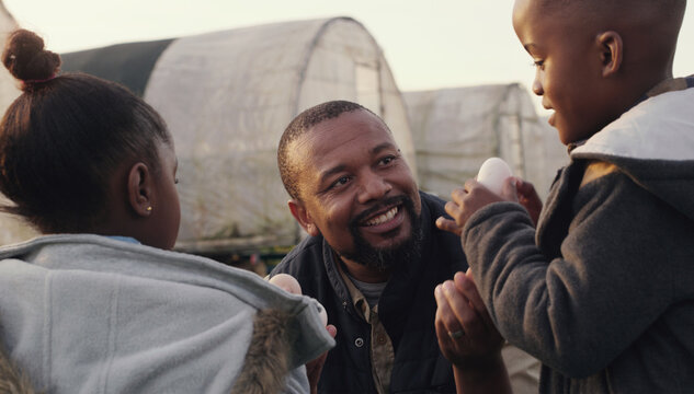Man, children and farm with chicken eggs at countryside for agriculture, teaching and learning. Black family, kids and father with poultry in farming for harvest, development and export in Nigeria