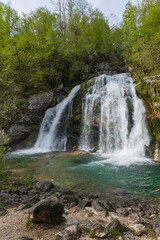 Bovec, Slovenia. Visje waterfalls. Nature trail crystal clear, turquoise water. easy trekking, nature experience, wood path. Waterfalls inside a forest, long photographic exposure, power of nature.