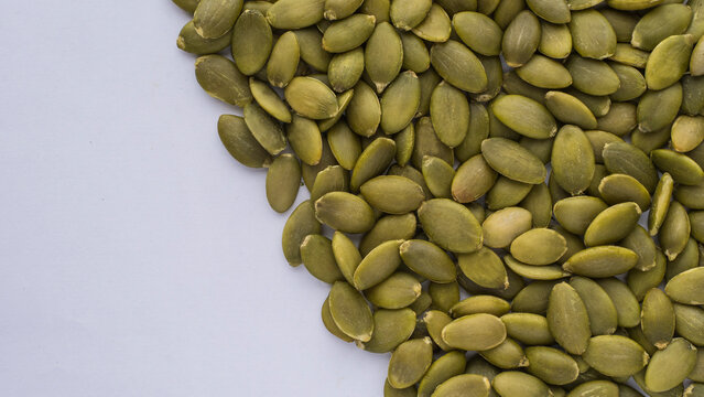 Background image template with blank space and a part filled with pumpkin seeds.