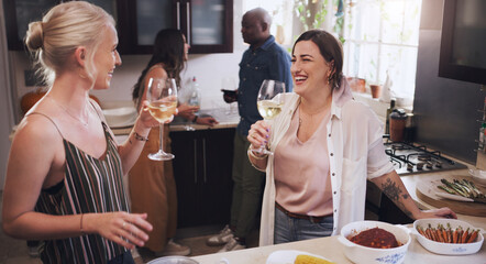 Chatting, wine and friends in kitchen of home together for bonding, drinking alcohol or visit. Glass, happy and smile with relax and young women in conversation at apartment for celebration or party