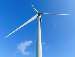 A large wind turbine is standing tall in the sky