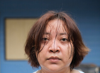 Portrait of a woman sweating after housework
