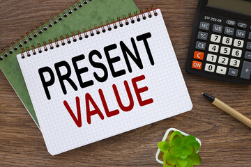 Present Value Business concept. dark work desk. text on page