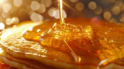 Fotobehang Close-Up of Honey Drizzle on Pancakes with Glowing Bokeh © Parintron