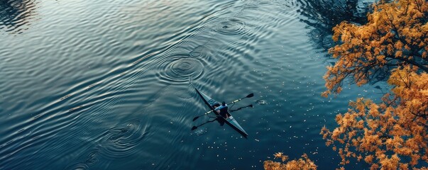 A solitary rower in a skiff on a serene lake encapsulating calm and reflection in nature