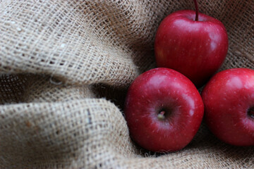 Heap Of Juicy Apples On Homemade Fabric At A Side Of Image. Concept Design For Fruits Backgrounds