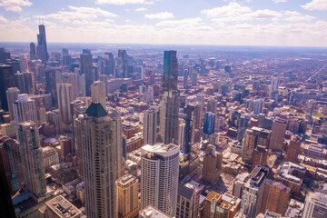 Chicago cityscape aerial view, spring day. High rise buildings, blue cloudy sky background, Chicago, United States